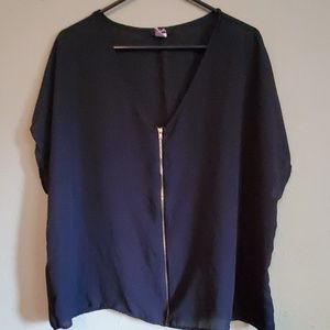 Short sleeve zipper front blouse.